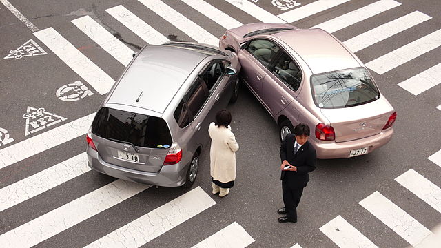 Photo showing two cars that collided front to side